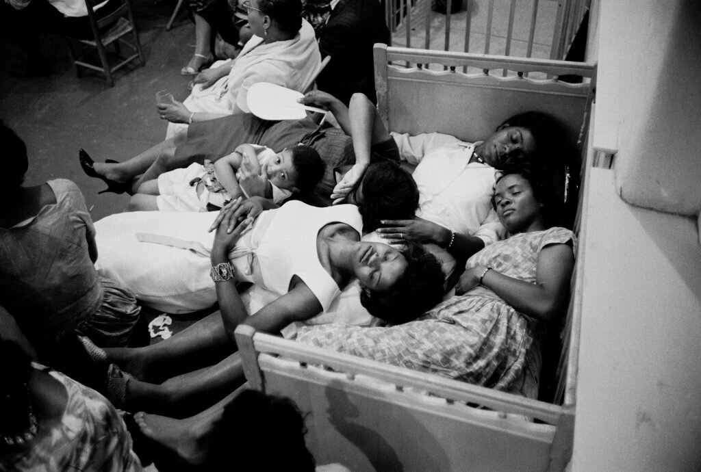 Photograph: Women taking a nap in church nursery during Freedom Summer Voters Right Movement in 1961. by: Paul Schutzer